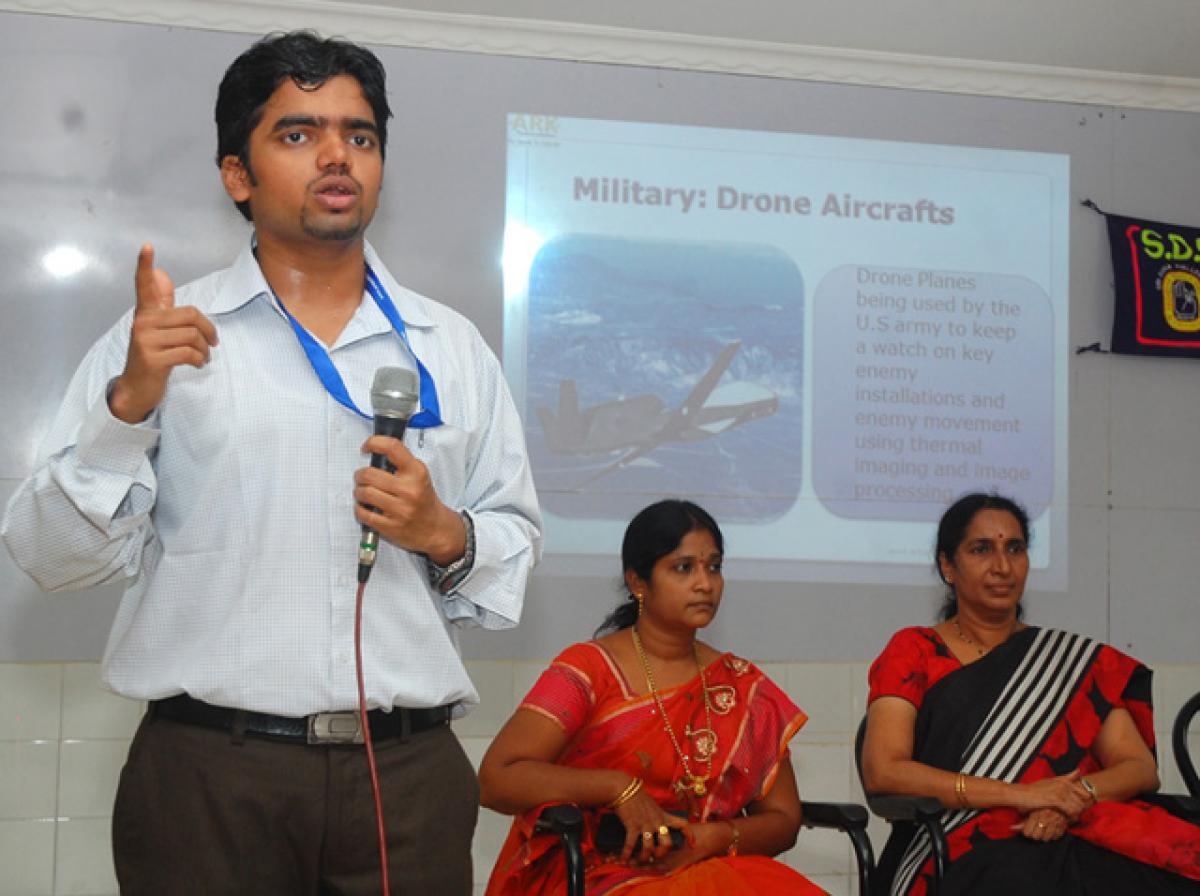 Bhushan Gandhi, a research engineer at ARK Technosolutions, Mumbai, speaking at a robotics workshop at Sri Durga Malleswara Siddhartha Mahila Kalasala